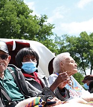 From left, Hughes Van Ellis, 100; Lessie Benningfield Randle, 106; and Viola Fletcher, 107, the oldest living survivor of the Tulsa Race Massacre and older sister of Mr. Van Ellis, attend the Black Wall Street Legacy Festival on May 28 in Tulsa, Okla.