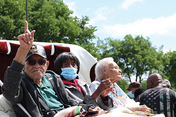 From left, Hughes Van Ellis, 100; Lessie Benningfield Randle, 106; and Viola Fletcher, 107, the oldest living survivor of the Tulsa Race Massacre and older sister of Mr. Van Ellis, attend the Black Wall Street Legacy Festival on May 28 in Tulsa, Okla.