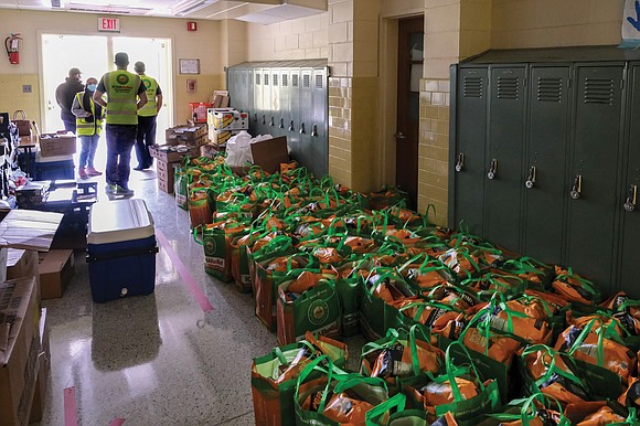 A new monthly curbside food distribution effort began last Saturday at Quioccasin Middle School in Henrico County, drawing long lines ...