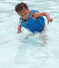 A real splash/Donovan Pelletier, 2, plays in the kiddie pool at the city’s Randolph Pool on Grayland Avenue in the West End. The toddler was enjoying Memorial Day with his mother, siblings and friends.