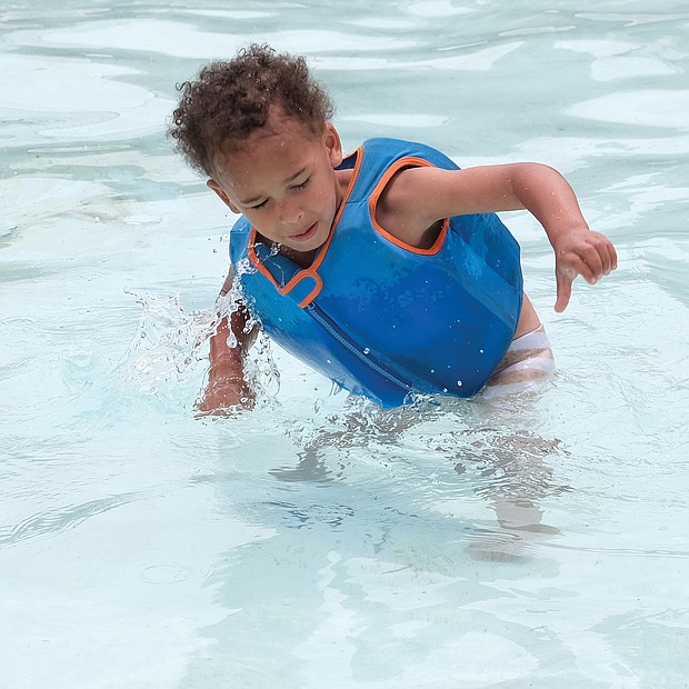 A real splash/Donovan Pelletier, 2, plays in the kiddie pool at the city’s Randolph Pool on Grayland Avenue in the West End. The toddler was enjoying Memorial Day with his mother, siblings and friends.