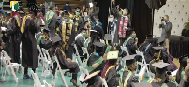 Wilberforce University graduates scream, shout and jump for joy as President Elfred Anthony Pinkard announces during last Saturday’s commencement that their debts to the school have been forgiven. The ceremony was streamed on the university’s YouTube channel.