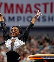 Simone Biles celebrates after competing in the vault during the US Gymnastics Championships, Sunday, June 6, in Fort Worth, Texas.
Mandatory Credit:	Tony Gutierrez/AP
