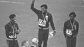 U.S. Olympic team sprinter Lee Evans, center, puts his fist up in a Black Power salute and protest against racism during the medal ceremony at the 1968 Summer Olympics in Mexico City. He and teammates Larry James, left, and Ron Freeman also wore black berets in protest while receiving their medals in the 400-meter race. Evans’ gold medal win in running 400 meters in 43.86 seconds set a record that stood until 1988.