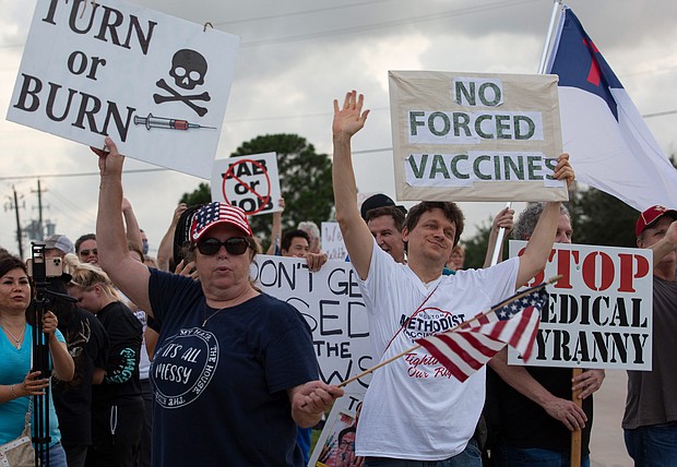 Protesters outside Houston Methodist Baytown Hospital in Baytown, Texas, on Monday, June 7. A small group of employees and supporters were protesting the hospital's policy of requiring employees to be vaccinated against Covid-19.
Mandatory Credit:	Yi-Chin Lee/Houston Chronicle/A