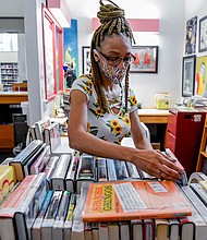 Librarian Sharice Towles at the Reading Public Library Main Branch in Reading, Pennsylvania, where officials have stopped charging fines on most library items because of the pandemic.
Mandatory Credit:	Ben Hasty/MediaNews Group/Reading Eagle/Getty Images