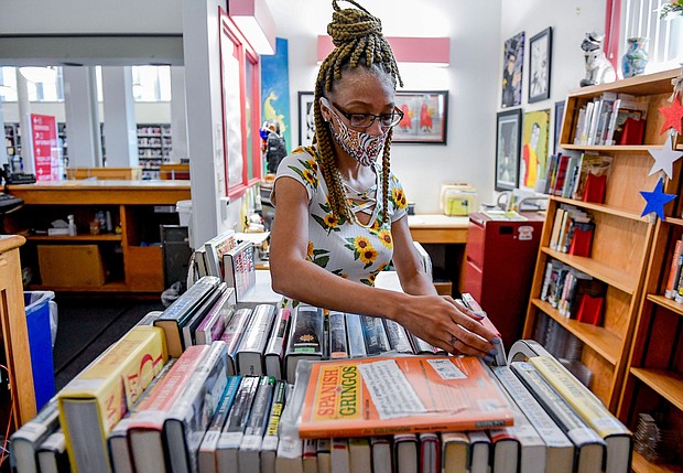 Librarian Sharice Towles at the Reading Public Library Main Branch in Reading, Pennsylvania, where officials have stopped charging fines on most library items because of the pandemic.
Mandatory Credit:	Ben Hasty/MediaNews Group/Reading Eagle/Getty Images