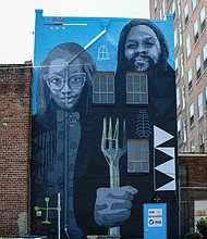 Cityscape: Slices of life and scenes in Richmond/The mural “African American Gothic” is a modern take on Grant Woods’ classic 1930 painting titled “American Gothic” that depicts an elderly farming couple with the man holding a pitchfork. This version, created by artists Andre Shank and Sone-Seeré, can be found on a building at 404 E. Grace St. in Downtown.