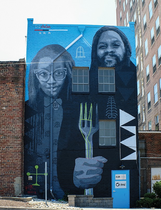 Cityscape: Slices of life and scenes in Richmond/The mural “African American Gothic” is a modern take on Grant Woods’ classic 1930 painting titled “American Gothic” that depicts an elderly farming couple with the man holding a pitchfork. This version, created by artists Andre Shank and Sone-Seeré, can be found on a building at 404 E. Grace St. in Downtown.