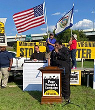 Rev. William J. Barber II, co-chair of the Poor People’s Campaign, delivers a speech Monday targeting U.S. Sen. Joe Manchin’s opposition to a proposed landmark overhaul of U.S. election law in Charleston, W.Va.