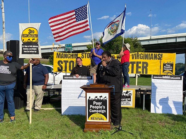 Rev. William J. Barber II, co-chair of the Poor People’s Campaign, delivers a speech Monday targeting U.S. Sen. Joe Manchin’s opposition to a proposed landmark overhaul of U.S. election law in Charleston, W.Va.