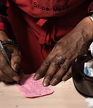 A shoe cobbler working in a black-owned business in Washington, DC.
Mandatory Credit:	Brendan Smialowski/AFP/Getty Images