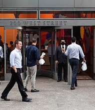 People enter the Goldman Sachs headquarters building in New York on Monday, June 14.
Mandatory Credit:	Michael Nagle/Bloomberg/Getty Images