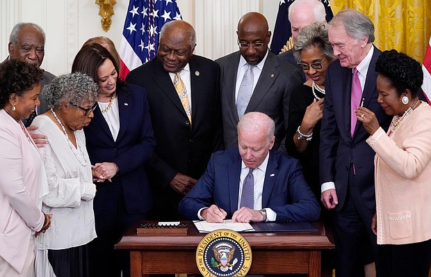 President Joe Biden signs the Juneteenth National Independence Day Act, in the East Room of the White House on June 17 in Washington.
Mandatory Credit:	Evan Vucci/AP