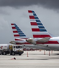 Customers who booked flights on American Airlines through July 15 will be notified or have already received notifications if their flights have been canceled.
Mandatory Credit:	Eva Marie Uzcategui/Bloomberg/Getty Images