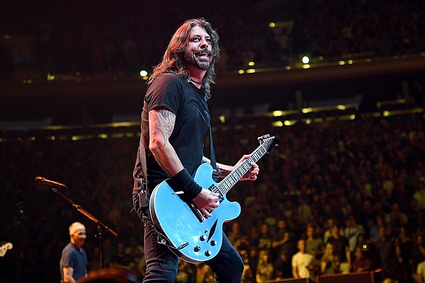 Dave Grohl performs onstage as The Foo Fighters reopen Madison Square Garden on Sunday.
Mandatory Credit:	Kevin Mazur/Getty Images