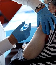 A healthcare worker administers the vaccine as the Empire State Building Offers COVID-19 vaccines at its Observatory in New York City.
Mandatory Credit:	Monica Schipper/Getty Images