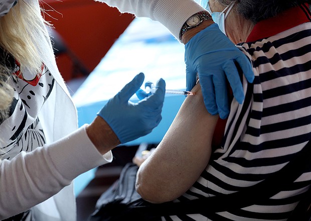 A healthcare worker administers the vaccine as the Empire State Building Offers COVID-19 vaccines at its Observatory in New York City.
Mandatory Credit:	Monica Schipper/Getty Images