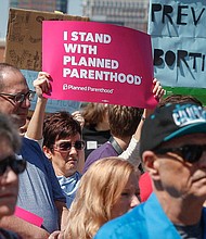 Supporters of Planned Parenthood gathered for a rally on Friday, May 4, 2018, at the Iowa Capitol grounds in Des Moines. An Iowa law requiring women to wait 24 hours before getting an abortion was permanently blocked by a district judge on June 21.
Mandatory Credit:	Byron Houlgrave/The Register/USA Today Network