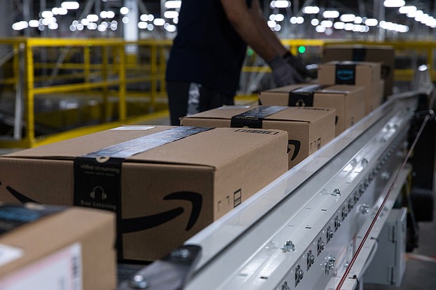 Boxes move along a conveyor belt at an Amazon fulfillment center on Prime Day in Raleigh, North Carolina on June 21. Amazon.com's annual Prime Day sale arrives as the world grapples with the lingering effects of the pandemic.
Mandatory Credit:	Rachel Jessen/Bloomberg/Getty Images