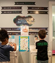 Children wash their hands as Aliesha Richardson, an employee at Busy Bee Academy, watches on April 9, 2020, in Bastrop, Texas.
Mandatory Credit:	Ana Ramirez/American-Statesman/USA Today Network