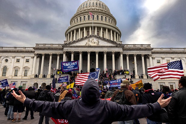 Pro-Trump protesters gather in front of the Capitol Building on January 6, 2021 in Washington. An alleged member of the Oath Keepers will plead guilty to charges related to the January 6 insurrection, the first plea deal among the Capitol riot cases against extremist groups, a notice filed in court says.
Mandatory Credit:	Brent Stirton/Getty Images