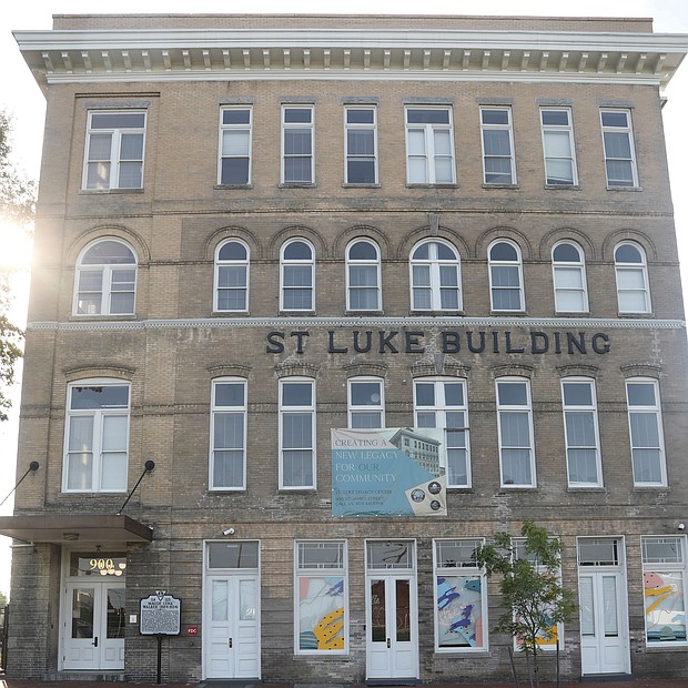 A new historic marker honoring Richmond business and civil rights leader Maggie L. Walker sits in front of the historic St. Luke Building that has stood in the 900 block of St. James Street in Gilpin Court since 1903. 
Now a 12-unit apartment building with first-floor commercial space, the building began life as the national headquarters of the United Order of St. Luke, a Black fraternal and insurance group led by Mrs. Walker from 1899 until her death in 1934. Making bold moves, she pushed the fraternal order into developing the headquarters and taking other entrepreneurial action, including opening a bank.