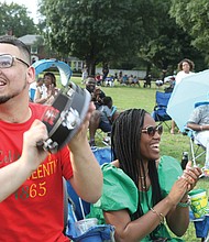 More than 1,000 people relaxed on the lawn of Virginia Union University, enjoying the sounds of local gospel groups at “Juneteenth: Sounds of Freedom Celebration” on Saturday evening. The event was sponsored by the new Hezekiah Walker Center for Gospel Music at VUU. Below, Marcus Orr of Ashland joins in with his tambourine.