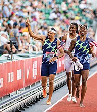 Randolph Ross Jr., center, takes victory lap with his new Olympic teammates Michael Norman, left, and Michael Cherry. They were the top three finishers in the 400 meters during last week’s Olympic trials in Eugene, Ore.