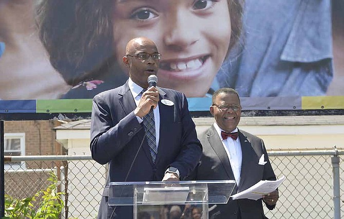 Daryl Newell, president of Seaway Bank, stands at the podium with NBC 5’s Art Norman, who served as the emcee of the event. Photo by John Alexander