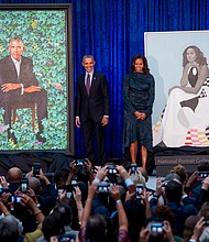 Three years after Barack and Michelle Obama's official portraits were unveiled at the Smithsonian's National Portrait Gallery, the paintings have arrived at the Art Institute of Chicago, where the former President and First Lady had their very first date.
Mandatory Credit:	Saul Loeb/AFP/Getty Images