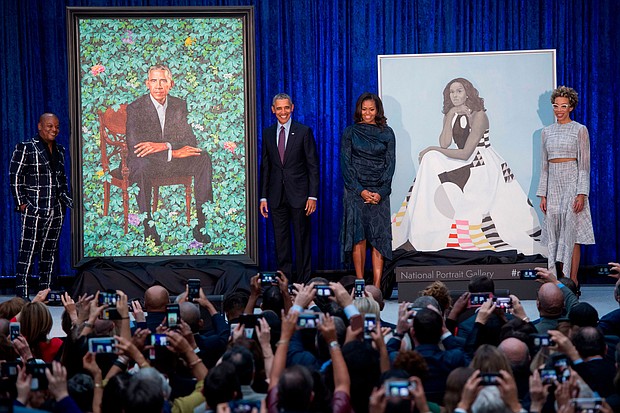 Three years after Barack and Michelle Obama's official portraits were unveiled at the Smithsonian's National Portrait Gallery, the paintings have arrived at the Art Institute of Chicago, where the former President and First Lady had their very first date.
Mandatory Credit:	Saul Loeb/AFP/Getty Images