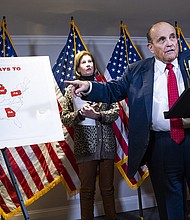Rudolph Giuliani, attorney for President Donald Trump, conducts a news conference at the Republican National Committee on lawsuits regarding the outcome of the 2020 presidential election on November 19, 2020.
Mandatory Credit:	Tom Williams/CQ-Roll Call/Getty Images