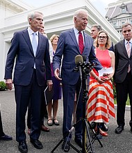 President Joe Biden, with a bipartisan group of senators, speaks Thursday June 24, 2021, outside the White House in Washington. Biden invited members of the group of 21 Republican and Democratic senators to discuss the infrastructure plan.
Mandatory Credit:	Jacquelyn Martin/AP