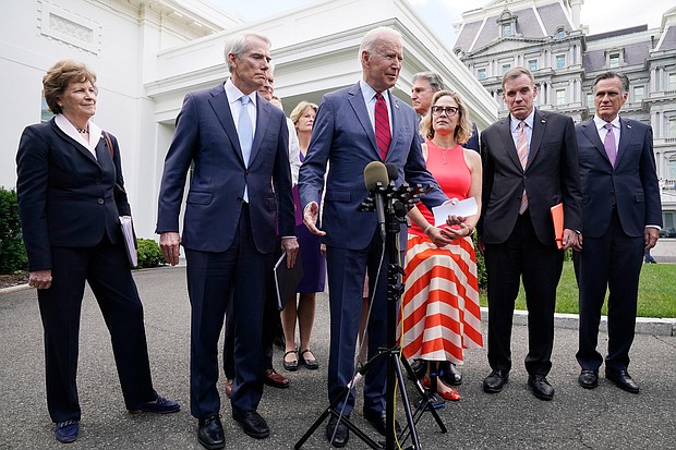 President Joe Biden, with a bipartisan group of senators, speaks Thursday June 24, 2021, outside the White House in Washington. Biden invited members of the group of 21 Republican and Democratic senators to discuss the infrastructure plan.
Mandatory Credit:	Jacquelyn Martin/AP