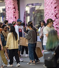 People congregate in front of the decorations during the Macy's Flower Show at Macy's Herald Square amid the coronavirus pandemic on May 2.
Mandatory Credit:	Alexi Rosenfeld/Getty Images