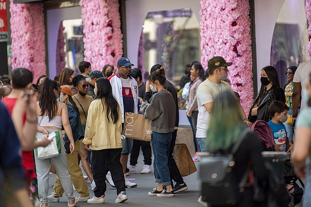People congregate in front of the decorations during the Macy's Flower Show at Macy's Herald Square amid the coronavirus pandemic on May 2.
Mandatory Credit:	Alexi Rosenfeld/Getty Images