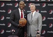 Chauncey Billups (left) and Neil Olshey pose Tuesday after Billups was announced as the head coach of the Portland Trail Blazers at the team's practice facility in Tualatin.  (AP photo)