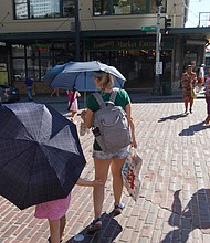 The extreme heat wave in the Northwest is beginning to subside in Seattle and Portland, Oregon, but millions remain under heat alerts. Pictured, people during a heat wave hitting the Pacific Northwest, on June 27, in Seattle.
Mandatory Credit:	John Froschauer/AP