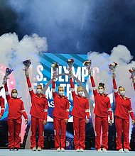 Members of the U.S. Women’s Olympic Gymnastic Team and alternates celebrate Sunday after the women’s U.S. Olympic Gymnastics Trials in St. Louis.