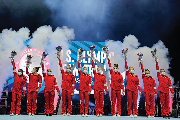 Members of the U.S. Women’s Olympic Gymnastic Team and alternates celebrate Sunday after the women’s U.S. Olympic Gymnastics Trials in St. Louis.