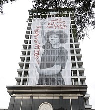 Cityscape: Slices of life and scenes in Richmond/This is one of two 160-foot banners now covering the sides of Richmond City Hall that promote city youths and their ambitions for bright futures. This one features Ta’Dreama McBride, with the second to carry the image of Clyde Walker, both city high school students and leaders in RISE for Youth. The art project, called “Freedom Constellations,” is being officially unveiled and celebrated at noon Thursday, July 1, with a program on the plaza of the city Social Services Building at 9th and Marshall streets across from City Hall.