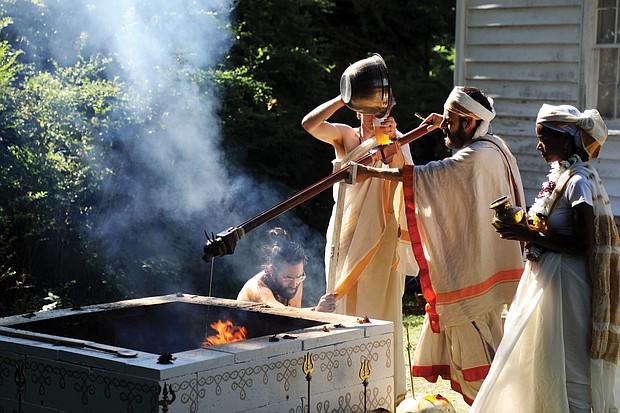 Neil Parmeswar, Grant Ottinger, Hindu priest Gananathamritananda Swamiji and Dominique
Gay participate in a fire ceremony at Quietude, a former plantation in Hanover County, to heal the spirit wounds remaining from slavery and to bring peace and harmony to the site for the future.
