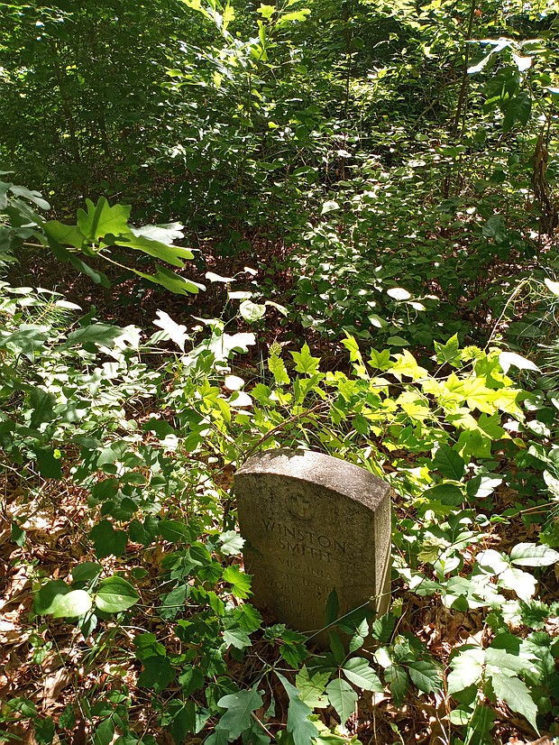 This headstone in the Smith family cemetery at 2511 Hopkins Lane in South Side is visible from the street. At least 45 people are believed to be buried at the site, which is said to have been a private burial ground for the enslaved from a nearby plantation.