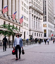 A pedestrian passes by the New York Stock Exchange (NYSE) building in New York, U.S., on Monday, June 14. US stock futures tumbled July 8 as investors grew fearful that the electric global economic rebound was slowing.
Mandatory Credit:	Nina Westervelt/Bloomberg/Getty Images