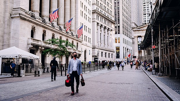 A pedestrian passes by the New York Stock Exchange (NYSE) building in New York, U.S., on Monday, June 14. US stock futures tumbled July 8 as investors grew fearful that the electric global economic rebound was slowing.
Mandatory Credit:	Nina Westervelt/Bloomberg/Getty Images