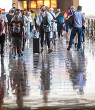 Wearing face masks, people walk through Union Station in Los Angeles on June 29. California is one of the 24 states seeing an uptick in Covid-19 cases.
Mandatory Credit:	Francine Orr/Los Angeles Times/Getty Images