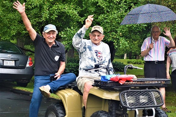 John Stanley Pioro turned 100 years old on Wednesday. He did not celebrate quietly. There were honking horns, blaring sirens …