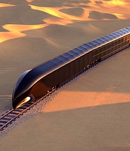 A G Train is shown riding through a desert.
Mandatory Credit:	Courtesy Thierry Gaugain