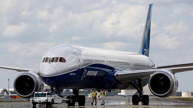 Boeing employees walk the Boeing 787-10 Dreamliner down towards the delivery ramp area at the company's facility in South Carolina after conducting its first test flight in 2017. On July 13 Boeing disclosed a new issue with the jet, which has been dogged with problems since August.
Mandatory Credit: Mic Smith/AP